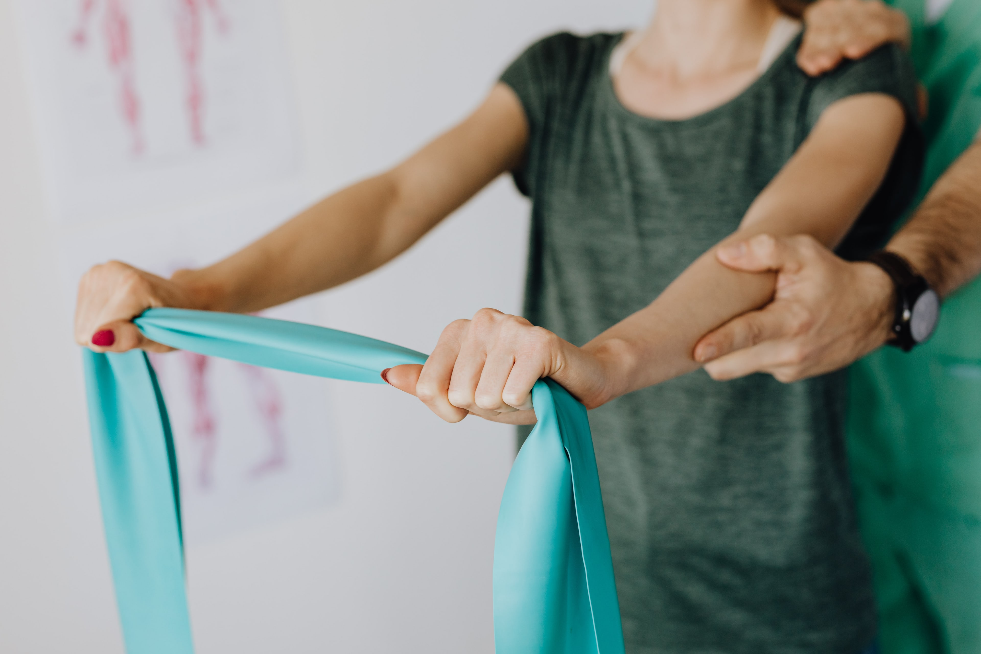 A physical therapist assisting a patient during treatment